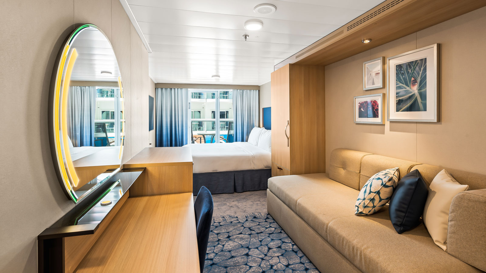 Boardwalk View Balcony stateroom aboard Utopia of the Seas with the neighborhood visible beyond the balcony