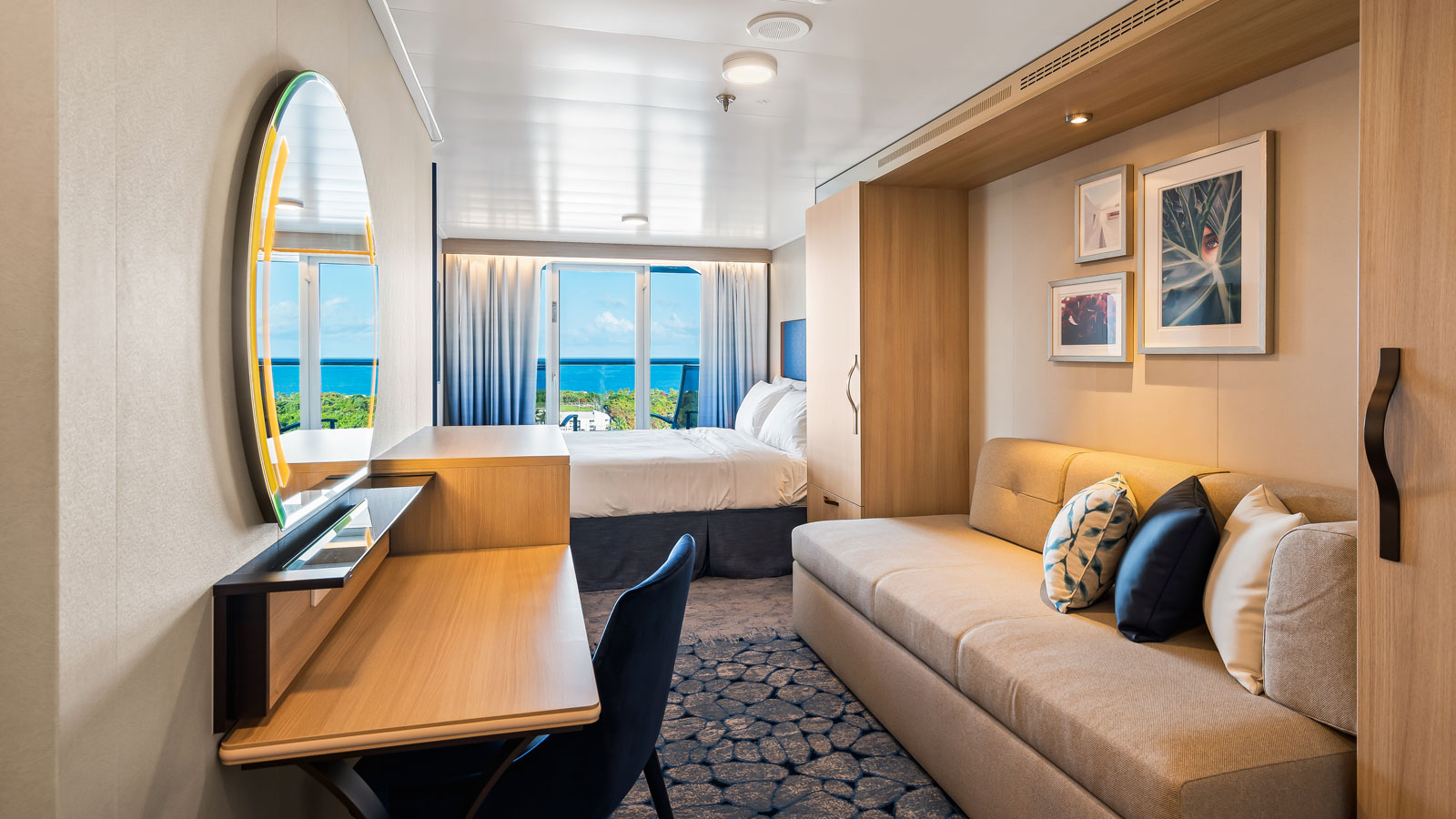 Ocean View Balcony stateroom aboard Utopia of the Seas with blue ocean visible through the balcony doors